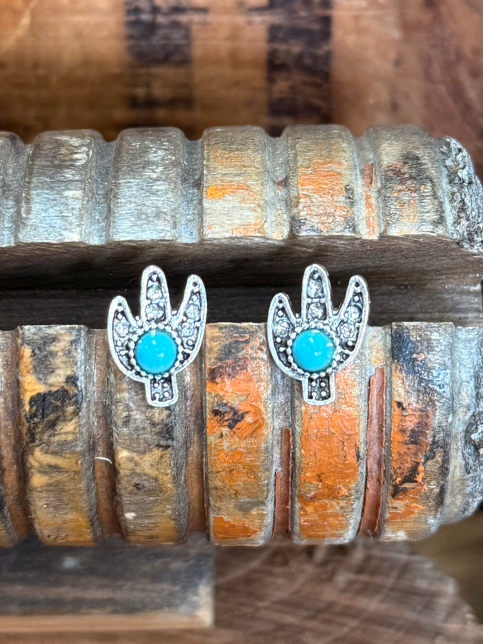 Pair of cactus stud earrings with turquoise oval crystals and silver-tone frames