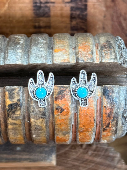 Pair of cactus stud earrings with turquoise oval crystals and silver-tone frames