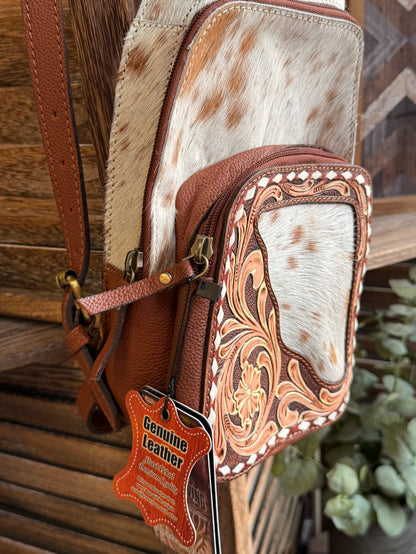 Hair-on cowhide sling backpack with adjustable strap and Genuine Leather patch