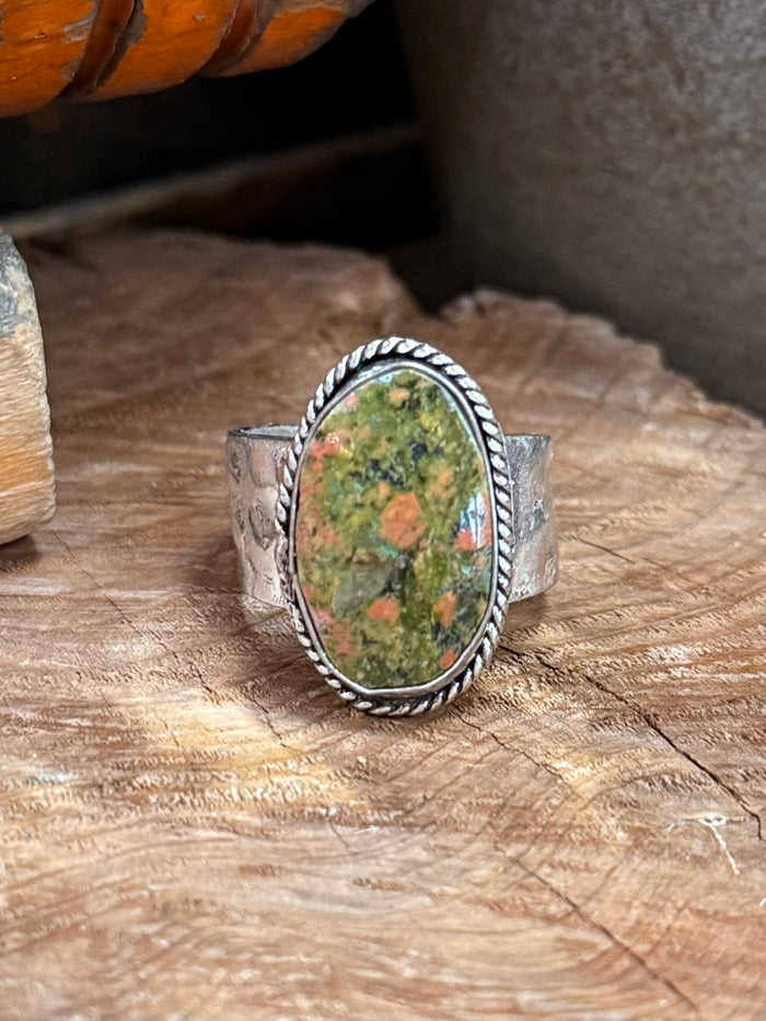 Oval green orange natural stone adjustable ring, braided bezel and open band sides