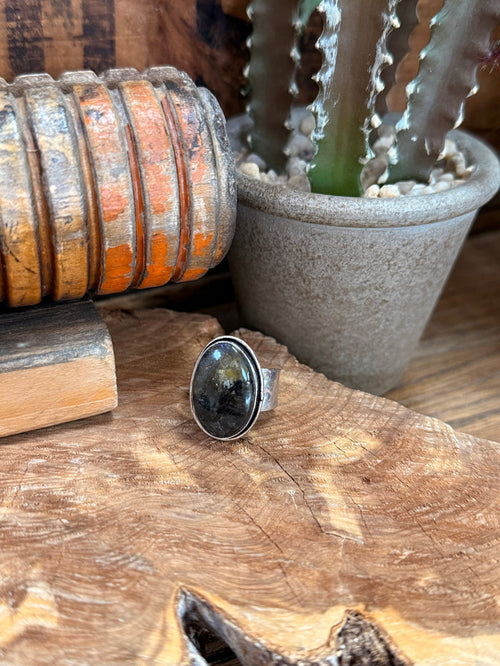 Adjustable silver-plated ring with oval dark labradorite stone, bezel setting
