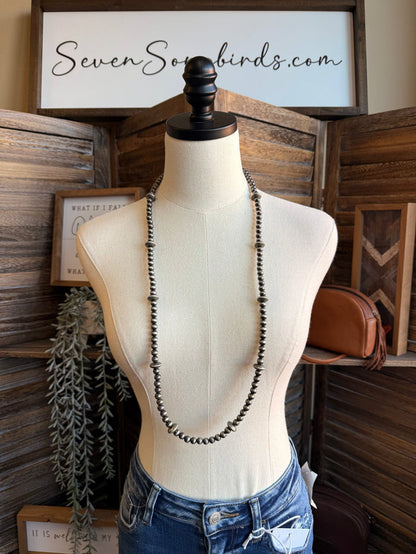 Silver-tone pearl bead long necklace with Y-style drape on mannequin