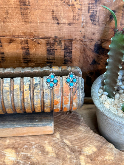 Turquoise diamond cluster stud earrings with silver-tone setting, round flower design
