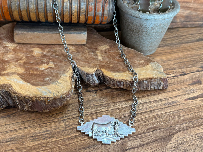 Silver cattle pendant necklace with engraved cow medallion on link chain