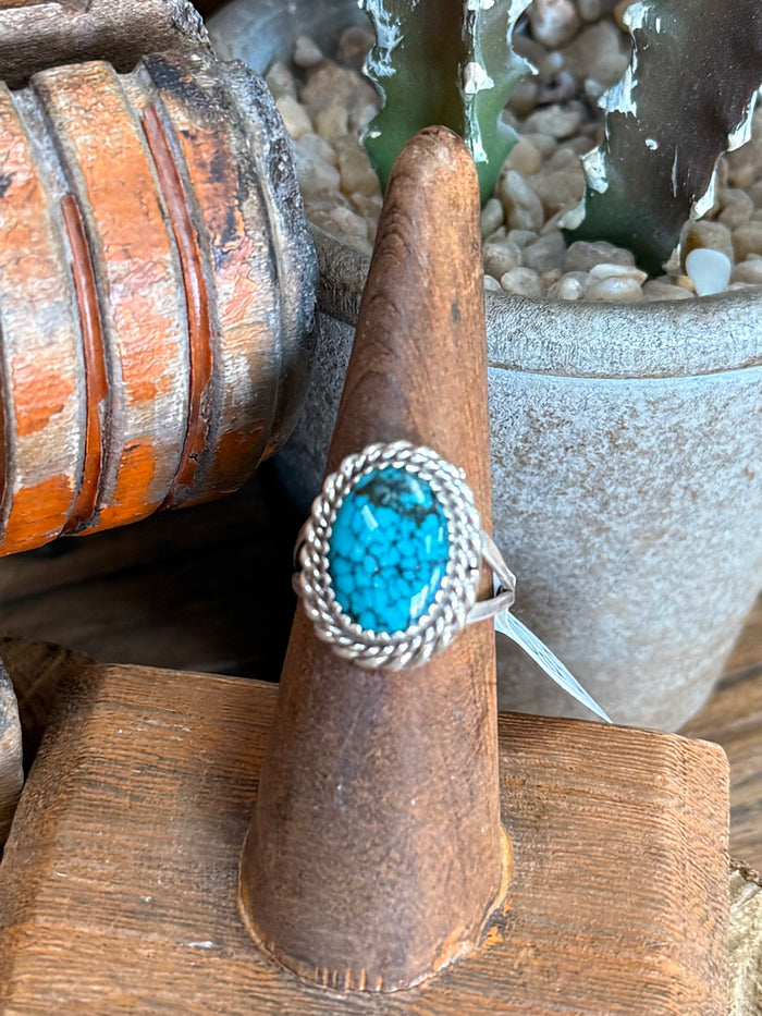 Turquoise oval sterling silver ring with twisted wire bezel and rope border, size 7
