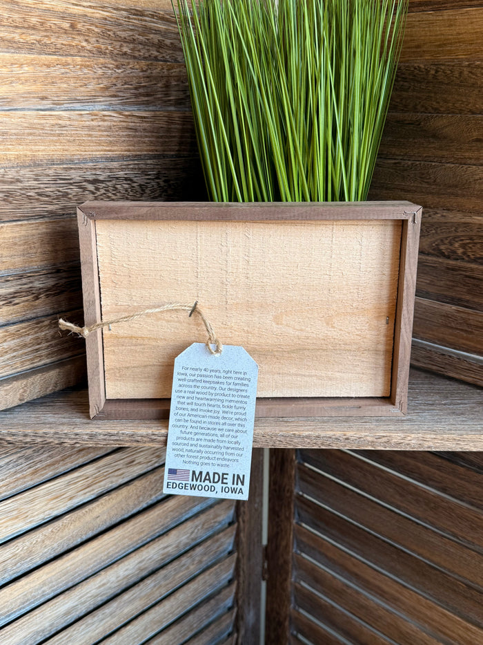 Wood framed artwork with hanging tag reading "Made in Edgewood, Iowa"