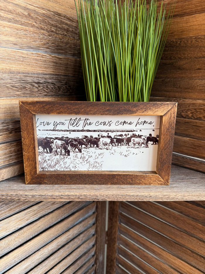 Rustic framed artwork with cow herd print and cursive quote
