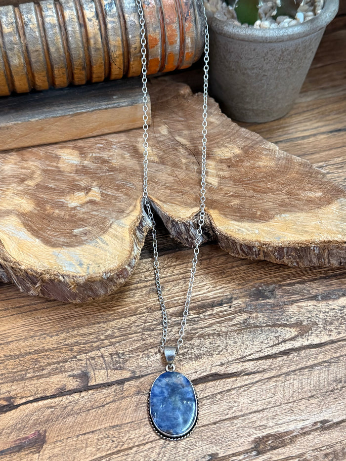 Layered silver-plated necklace with oval blue sodalite pendant and two chains
