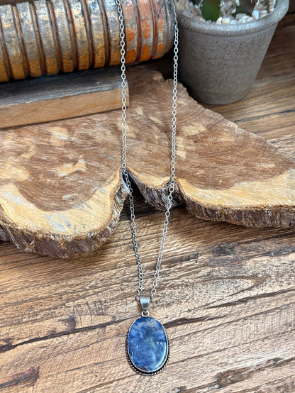 Layered silver-plated necklace with oval blue sodalite pendant and two chains