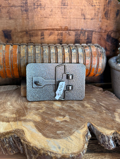 Silver belt buckle with engraved toggle clasp and crossbar detail