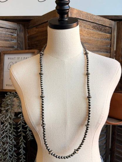 Silver-tone pearl bead long necklace, even front drape on mannequin
