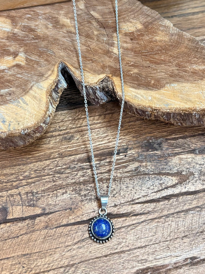 Silver-plated necklace with blue round pendant; thin link chain