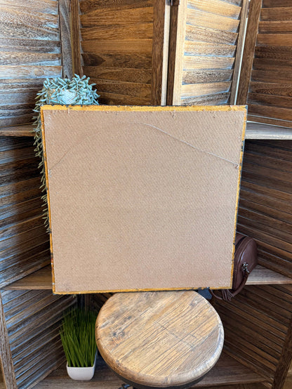 Back of framed artwork with plain beige panel and distressed blue frame