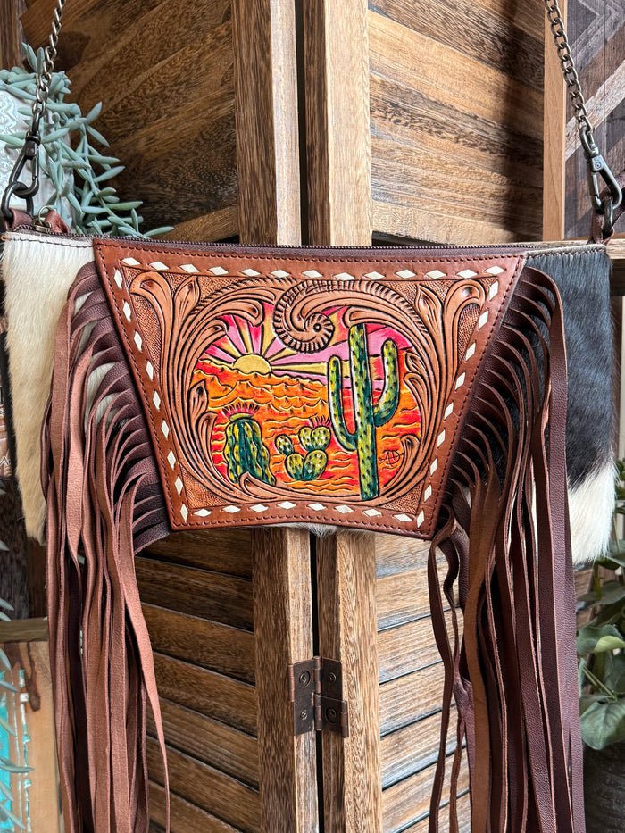 Tooled cowhide fringe crossbody purse with cactus-sunset front and chain straps