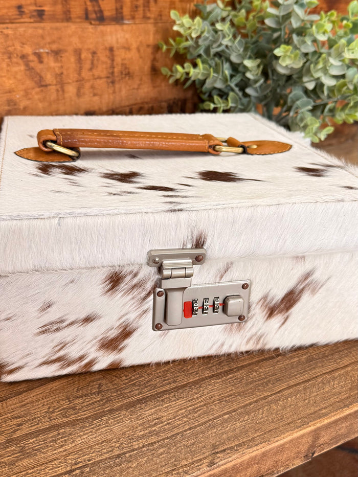 Hair-on cowhide jewelry box, tan leather strap, metal combination lock panel