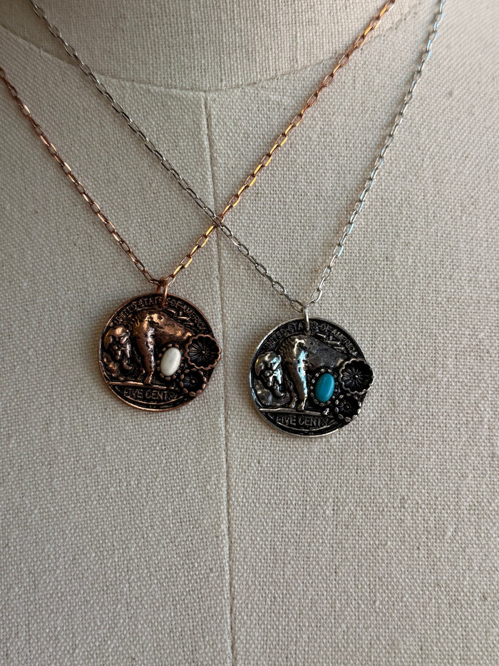 Round coin pendant necklace with stone inlays, two coin designs on chain
