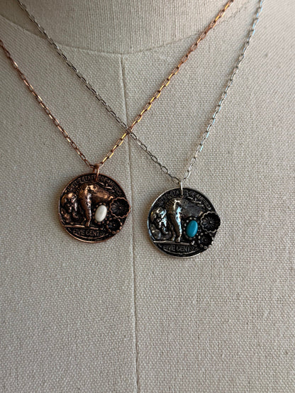 Round coin pendant necklace with stone inlays, two coin designs on chain