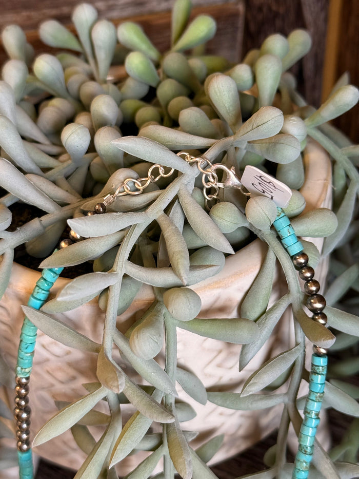 Blue turquoise heishi bead necklace with gold-tone beads and metal clasp