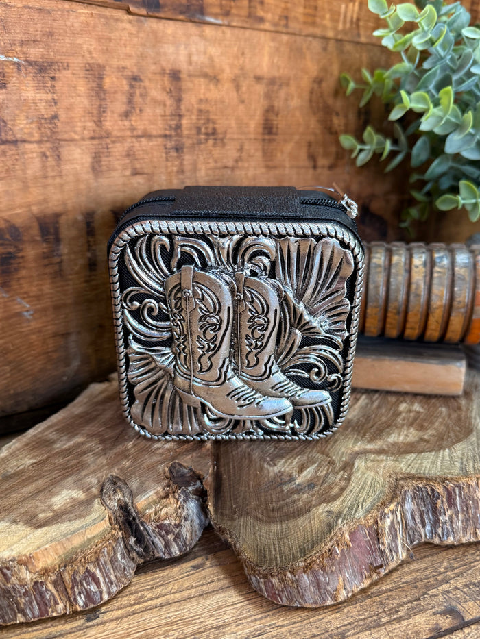Black engraved metal travel jewelry box with ornate peacock-style design