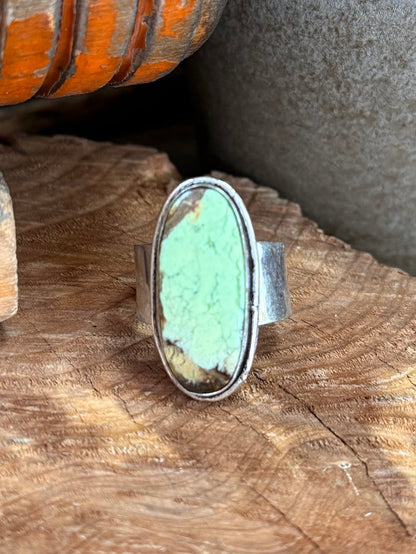 Adjustable oval chrysoprase stone ring, light green center in silver-tone frame
