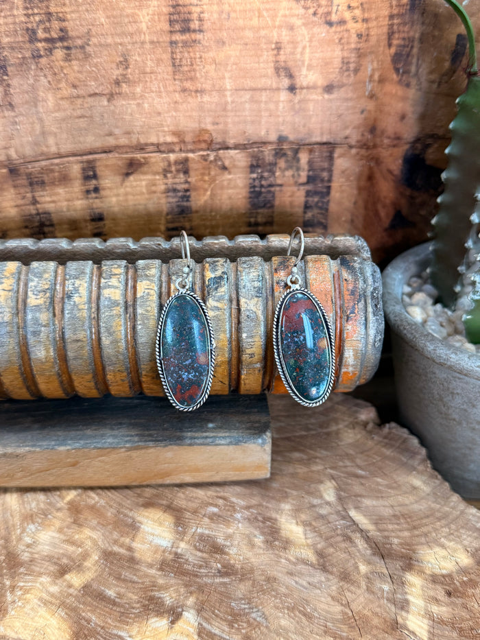 Oval red-blue stone fishhook earrings with silver-tone bezel settings