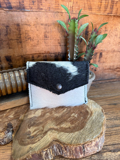 Hair-on envelope coin card wallet with black and white hide pattern.