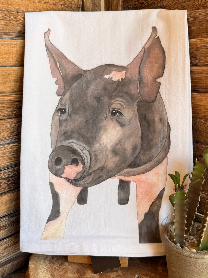 Pig watercolor tea towel close-up: white fabric with gray pig head illustration