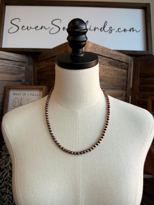 Copper bead necklace on mannequin, rounded copper bead strand
