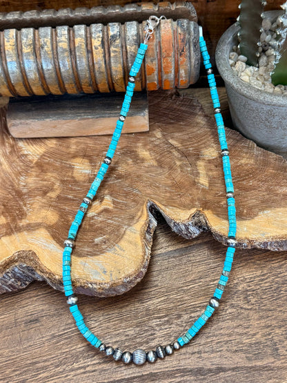 Long graduated turquoise heishi bead necklace with silver middle spacer beads