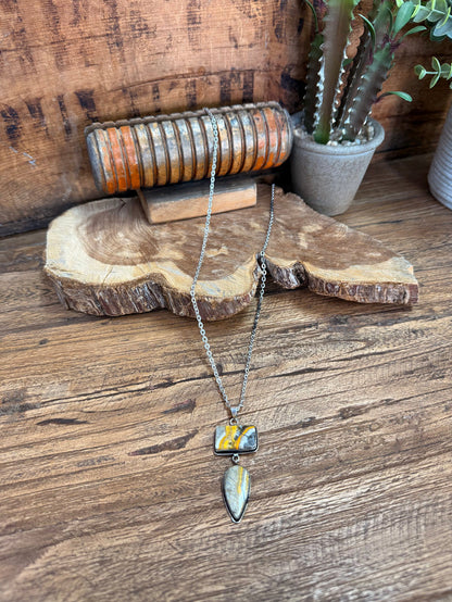 Silver plated lariat-style necklace with two blue-yellow stone pendants and chain
