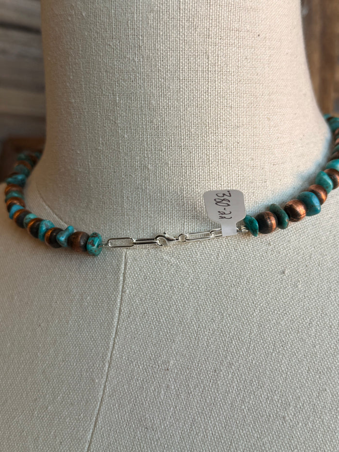 Copper and turquoise bead necklace clasp and extender on a display bust