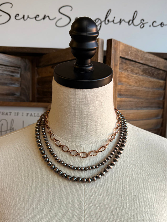 Triple-layer bead and chain necklace with dark beads and silver-tone oval link chain