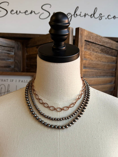 Triple-layer bead and chain necklace with dark beads and silver-tone oval link chain