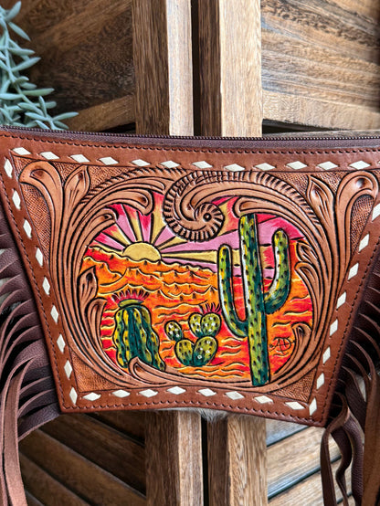 Tooled cowhide purse front panel with colorful cactus and desert sunset art