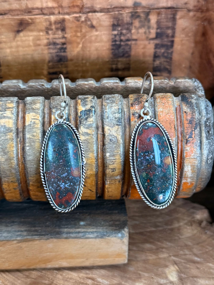 Pair of oval red-blue stone dangle earrings on silver-tone fishhooks
