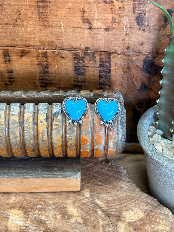 Large turquoise heart stud earrings with silver beaded border and dangling star charms
