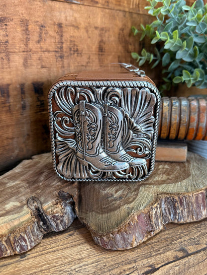 Engraved metal travel jewelry box with ornate scrollwork, front view and clasp