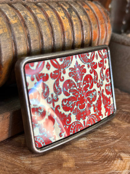 Red damask belt buckle with silver frame and glossy red floral pattern