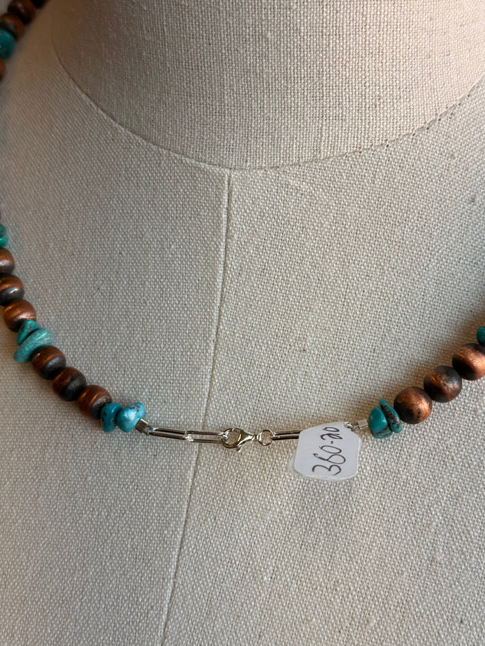 Copper and turquoise beaded necklace with lobster clasp and white tag