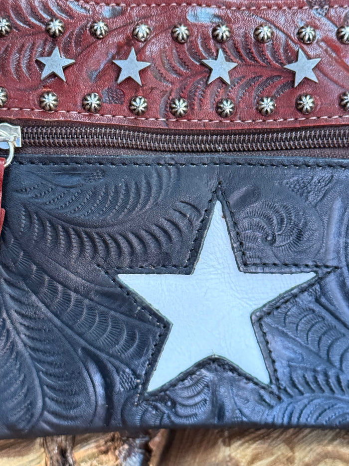 Blue leather star front panel on maroon crossbody purse with zipper