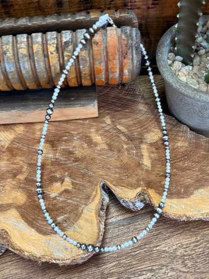 Freshwater pearl choker necklace featuring light pearls and silver bead accents