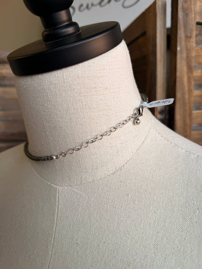 Silver chain necklace with turquoise heart pendant and clasp detail