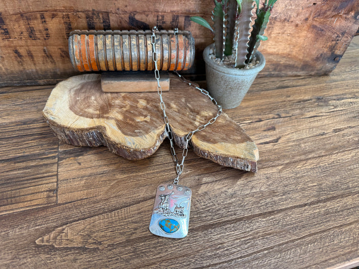 Turquoise roper-style necklace with silver chain and rectangular world map pendant