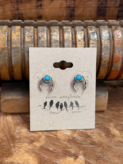 Silver-tone turquoise stud earrings with oval stones and curved silver details
