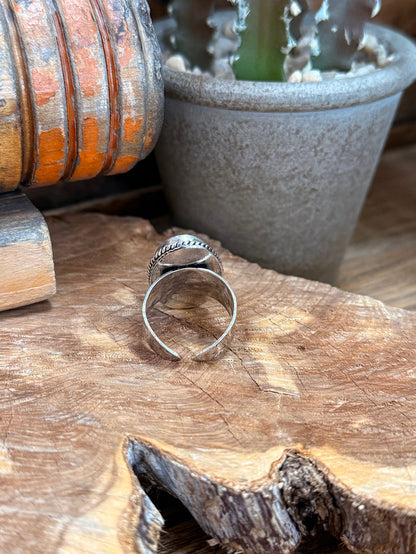 Open-back adjustable ring band with oval light-blue opal stone, silver-tone metalwork
