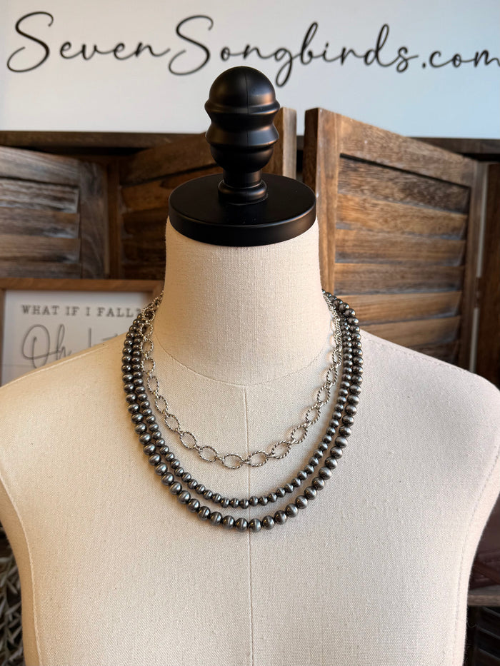 Triple-layer bead and chain necklace with dark beads and silver-tone links