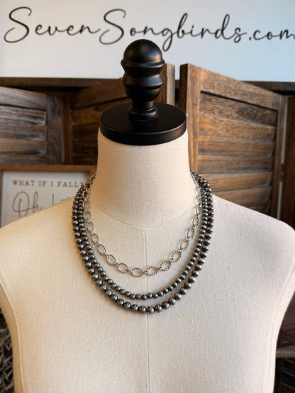 Triple-layer bead and chain necklace with dark beads and silver-tone links