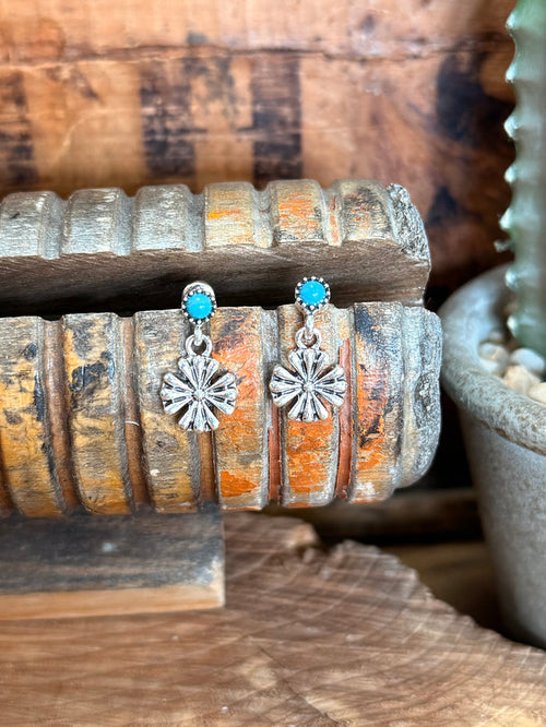 Silver-tone flower dangle stud earrings with turquoise round cabochon drops