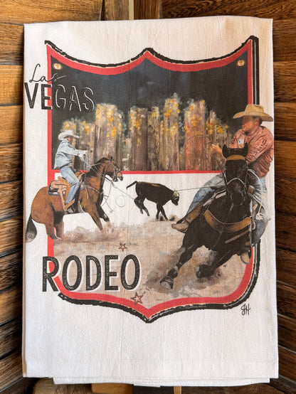 Rodeo watercolor tea towel with red crest border, cowboys on horseback, and RODEO lettering