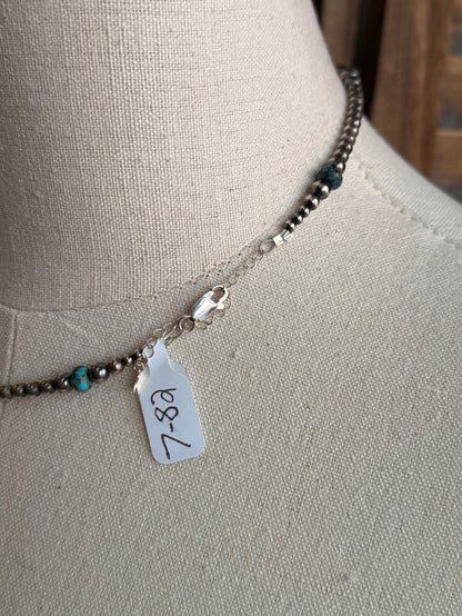 Sterling silver bead necklace with turquoise beads and price tag charm